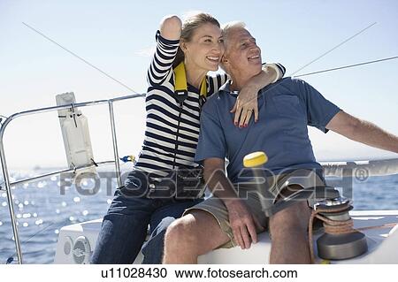 Older couple sitting on boat View Large Photo Image Stock Image - Older couple sitting on boat. Fotosearch