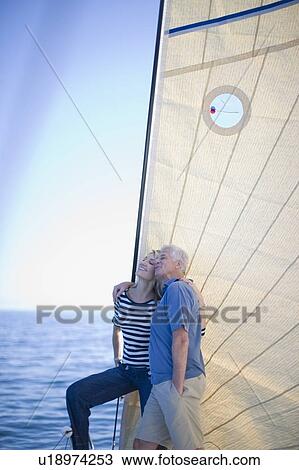 Older couple standing on sailboat View Large Photo Image Stock Image - Older couple standing on sailboat. Fotosearch