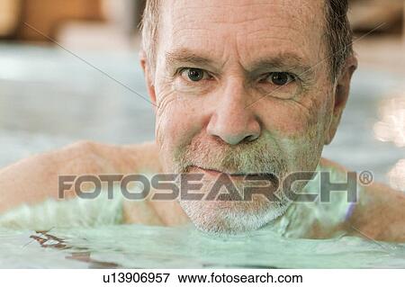 Older man swimming in pool View Large Photo Image Stock Photo - Older man swimming in pool. Fotosearch