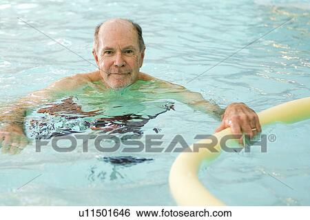 Older man swimming in pool View Large Photo Image Stock Photograph - Older man swimming in pool. Fotosearch