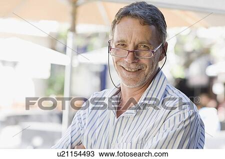 Older man wearing eyeglasses View Large Photo Image Stock Image - Older man wearing eyeglasses. Fotosearch
