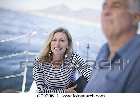 Older woman smiling on boat View Large Photo Image Stock Image - Older woman smiling on boat. Fotosearch
