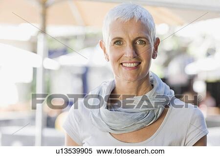 Stock Photography - Older woman wearing gray scarf. Fotosearch