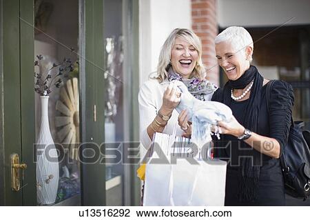 Older women shopping together View Large Photo Image Stock Image - Older women shopping together. Fotosearch
