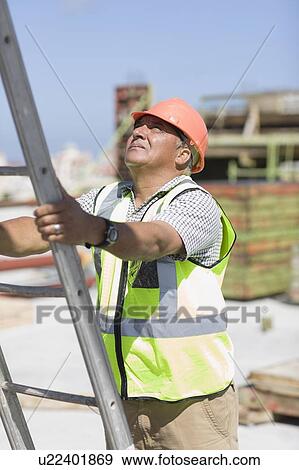 Older worker holding the ladder View Large Photo Image Stock Photo - Older worker holding the ladder. Fotosearch