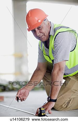 Older worker on construction site View Large Photo Image Stock Photo - Older worker on construction site. Fotosearch