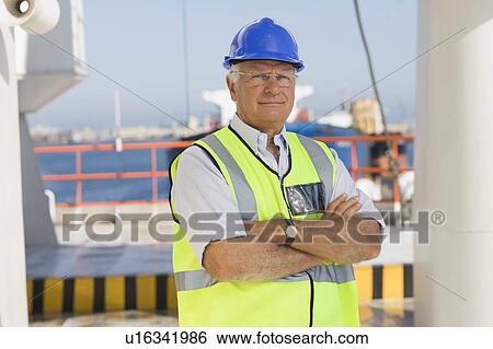 Stock Photograph - Older worker on ship. Fotosearch