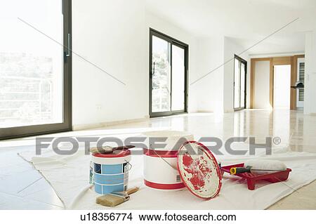 Paint and brushes in empty living room View Large Photo Image Picture - Paint and brushes in empty living room. Fotosearch