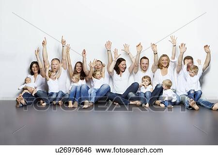 Parents and children cheering together View Large Photo Image Stock Photograph - Parents and children cheering together. Fotosearch