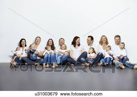 Parents and children sitting together View Large Photo Image Stock Photo - Parents and children sitting together. Fotosearch