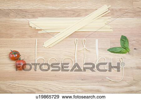 Pasta spelling out the word healthy View Large Photo Image Stock Photo - Pasta spelling out the word healthy. Fotosearch