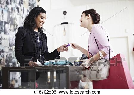 Paying with a card View Large Photo Image Stock Photograph - Paying with a card. Fotosearch