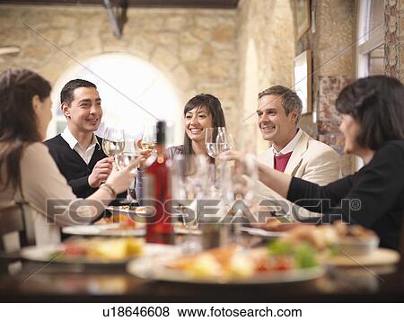 People celebrating in restaurant View Large Photo Image Stock Photo - People celebrating in restaurant. Fotosearch