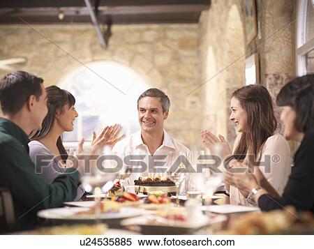 People celebrating in restaurant View Large Photo Image Stock Photography - People celebrating in restaurant. Fotosearch