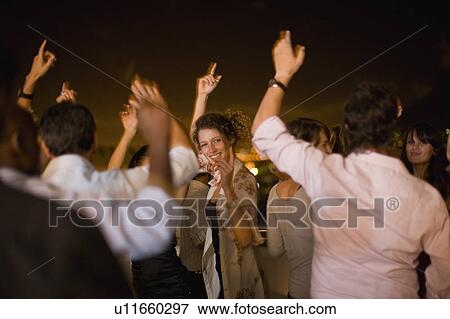 People dancing at party at night View Large Photo Image Stock Photo - People dancing at party at night. Fotosearch