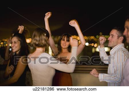People dancing at party at night View Large Photo Image Stock Photograph - People dancing at party at night. Fotosearch