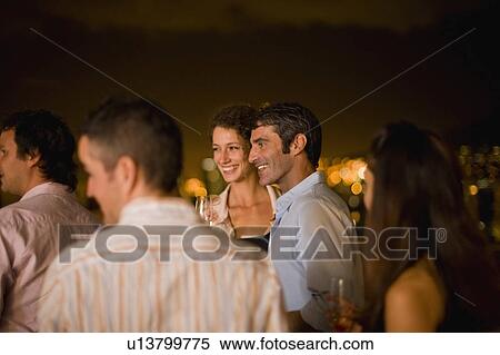People having wine on terrace at night View Large Photo Image Stock Photography - People having wine on terrace at night. Fotosearch