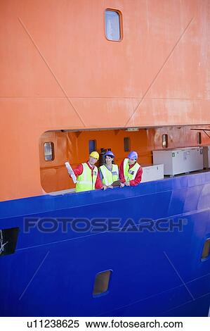 People in a dockyard View Large Photo Image Stock Photography - People in a dockyard. Fotosearch