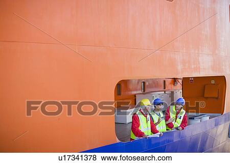 Stock Photo - People in dockyard. Fotosearch