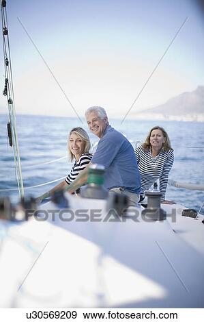 People sitting together on boat View Large Photo Image Stock Photo - People sitting together on boat. Fotosearch