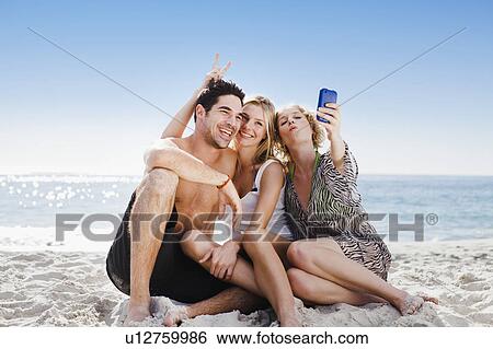 People taking picture on beach View Large Photo Image Stock Photograph - People taking picture on beach. Fotosearch