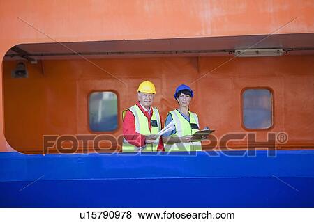 People working in a dockyard View Large Photo Image Stock Photo - People working in a dockyard. Fotosearch