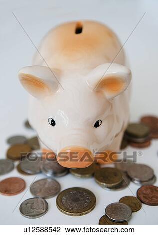 Stock Image - Piggy bank and coins. Fotosearch