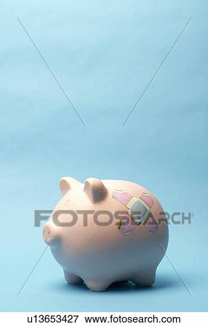 Piggy bank with plaster on it View Large Photo Image Stock Photo - Piggy bank with plaster on it. Fotosearch