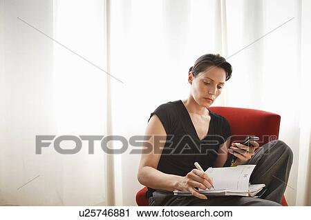 Stock Image - Planning a meeting. Fotosearch