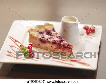 Plate of berry cheesecake in restaurant View Large Photo Image Stock Photo - Plate of berry cheesecake in restaurant. Fotosearch
