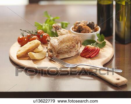 Plate of chicken and fruit at restaurant View Large Photo Image Stock Photo - Plate of chicken and fruit at restaurant. Fotosearch