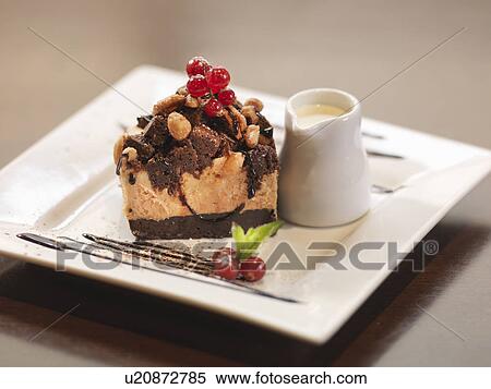 Plate of chocolate dessert in restaurant View Large Photo Image Stock Photography - Plate of chocolate dessert in restaurant. Fotosearch