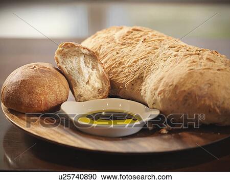 Plate of crusty bread in restaurant View Large Photo Image Stock Image - Plate of crusty bread in restaurant. Fotosearch