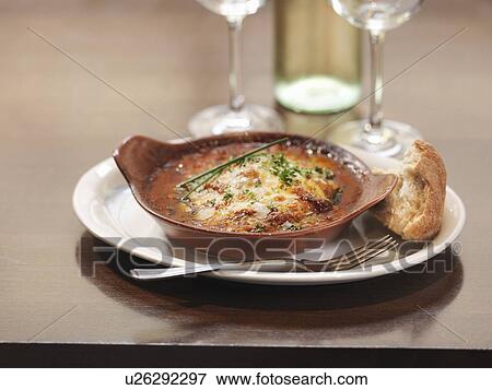 Plate of lasagna in restaurant View Large Photo Image Stock Photo - Plate of lasagna in restaurant. Fotosearch