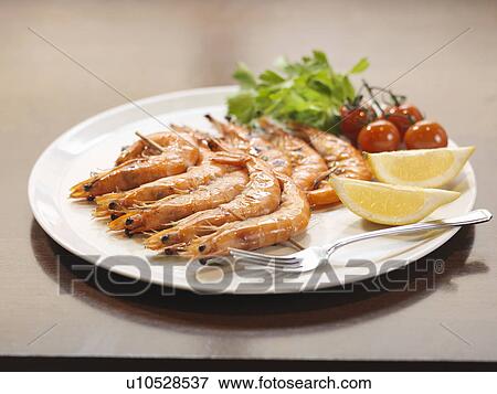 Stock Photo - Plate of prawns at restaurant. Fotosearch