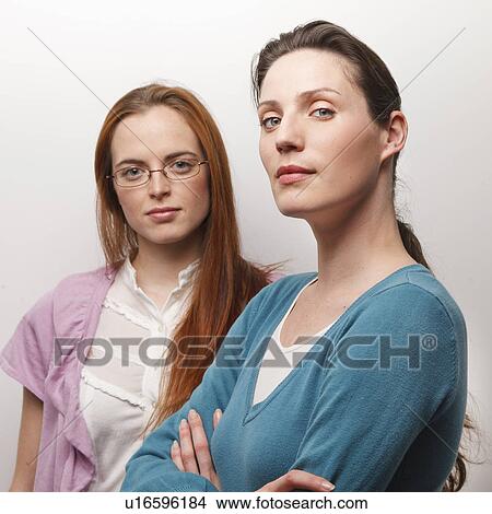 Picture - Portrait of 2 women in a office. Fotosearch