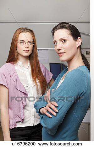 Portrait of 2 women in a office View Large Photo Image Stock Image - Portrait of 2 women in a office. Fotosearch
