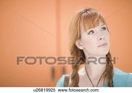 Portrait of a redhaired woman for orange View Large Photo Image Stock Photography - Portrait of a redhaired woman for orange. Fotosearch