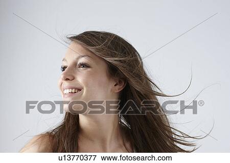 Stock Photo - Portrait of a woman smiling. Fotosearch