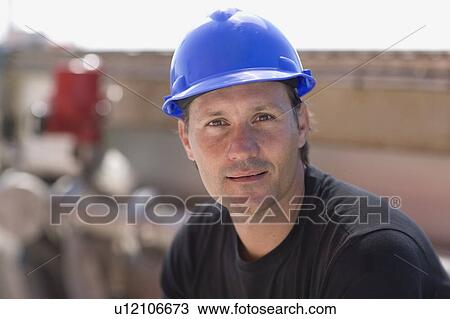 Stock Image - Portrait of a worker. Fotosearch