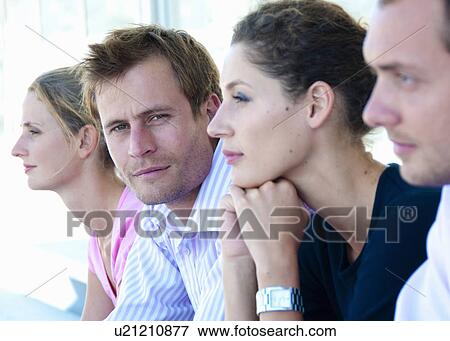 Stock Photo - Portrait of businessman in line up. Fotosearch