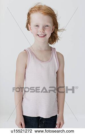 Stock Image - Portrait of girl with red hair. Fotosearch