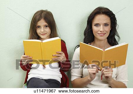 portrait of mother and daughter reading View Large Photo Image Stock Photo - portrait of mother and daughter reading. Fotosearch