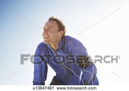 Portrait of sporty man from low angle View Large Photo Image Stock Image - Portrait of sporty man from low angle. Fotosearch
