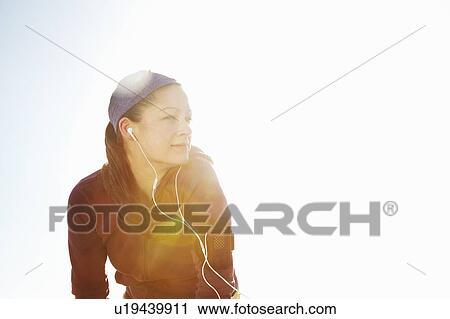 Portrait of sporty woman with lens flare View Large Photo Image Stock Image - Portrait of sporty woman with lens flare. Fotosearch