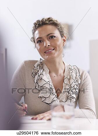 Stock Photograph - Portrait of woman in a Business Meeting. Fotosearch