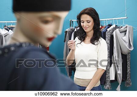 portrait of woman in clothes shop View Large Photo Image Stock Image - portrait of woman in clothes shop. Fotosearch
