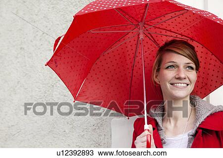 Portrait of woman with umbrella View Large Photo Image Stock Image - Portrait of woman with umbrella. Fotosearch