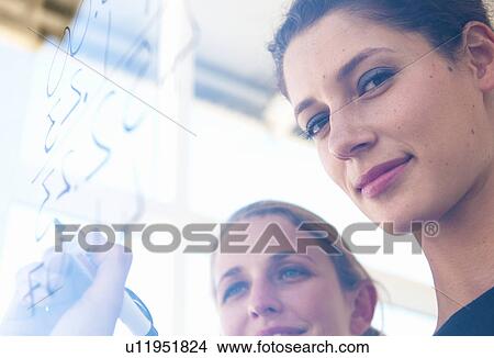 Portrait of woman writing on glass View Large Photo Image Picture - Portrait of woman writing on glass. Fotosearch