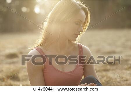 Stock Image - Portrait of Women in sunset on Meadow. Fotosearch